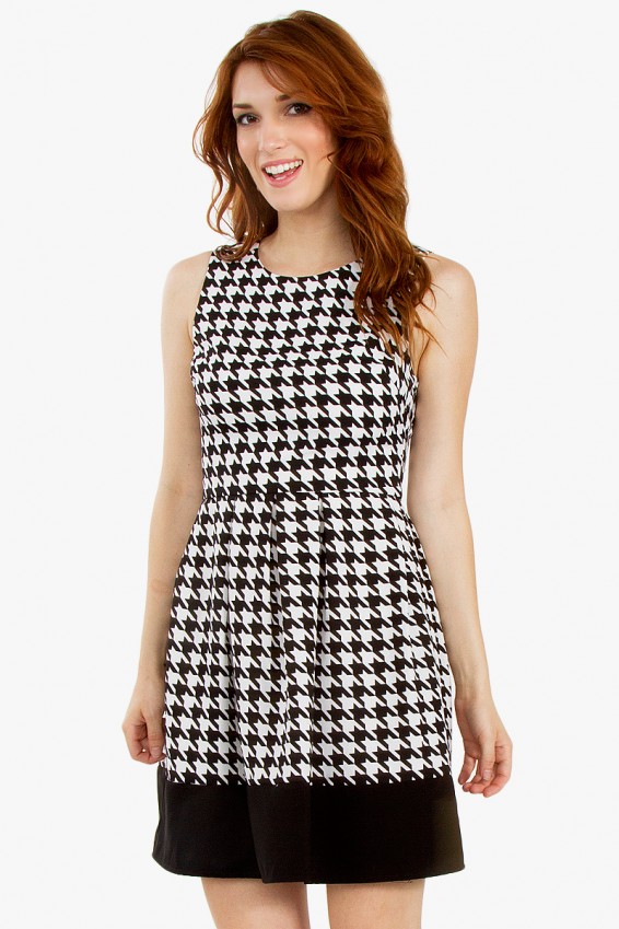 So Mod Houndstooth Dress 39.99 Make a statement in this oversized houndstooth printed dress. Features an A-line pleated skirt and a black contrast band at the hem. Enjoy Free Shipping and Easy Returns 